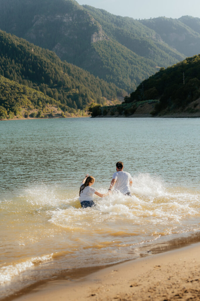 Couple splashing in the water