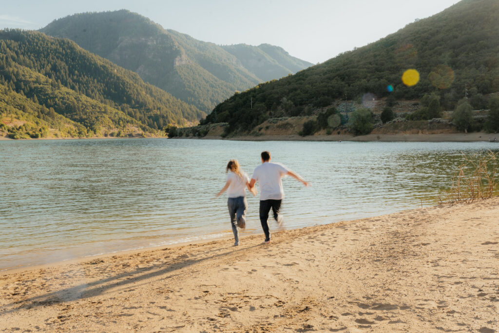 Couple running into the water