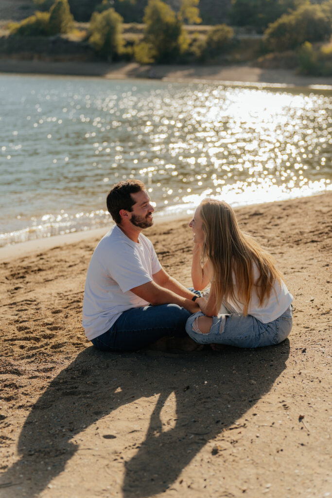 Couple sitting on South Carolina waterfront holding hands